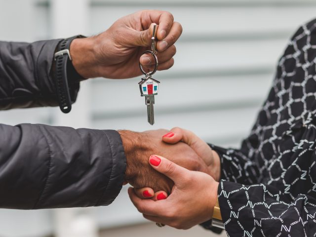 Real Estate Agent giving house keys